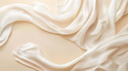 Obraz premium Soft ivory fabric drapes with curves over a smooth, light peach background