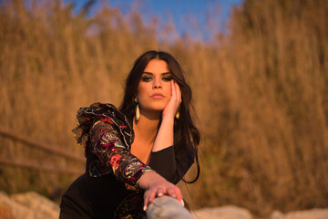 Portrait of woman, young, beautiful, brunette, flamenco dancer, with a beautiful black flamenco...