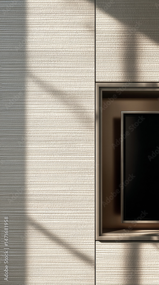 Poster beige textured wall with recessed area showcasing a dark screen, illuminated by sunlight creating sh