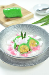 Green banana ice covered in a pandan leaf flour.