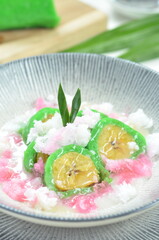 Green banana ice covered in a pandan leaf flour.