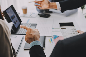 Team of financial advisory services. Asian advisor showing plan of investment to clients in the consultancy office..