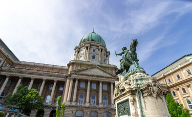 Equestrian statue and dome of Buda Castle with classical columns in Budapest, Hungary