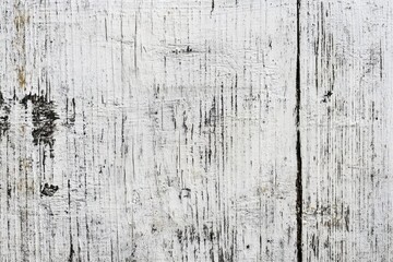 Obraz premium Weathered wooden planks with distressed white paint, showing texture and age in a rustic and textured surface.