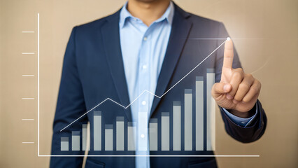 Businessman in blue suit interacting with virtual financial graph, futuristic data visualization concept