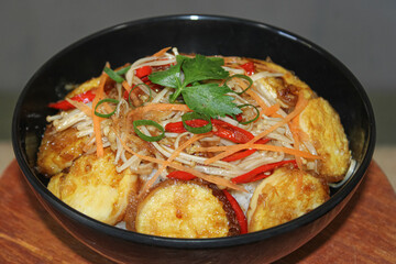 Delicious dish of stir-fried tofu rice bowl. delicious restaurant cuisine