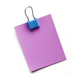 Lilac paper with a blue clip holding it together on white background