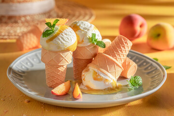 Tasty and cold peach ice cream made of juicy fruit.