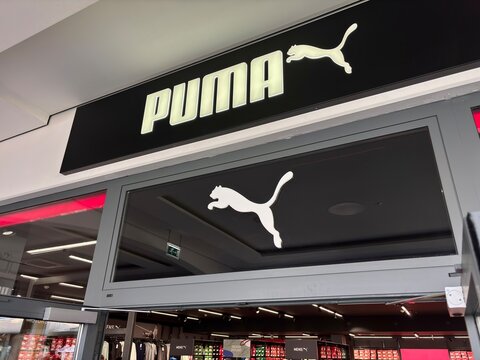 Puma store in Parndorf, Austria showcasing outdoor footwear, apparel, and accessories Austria, Parndorf - 04-05-2025