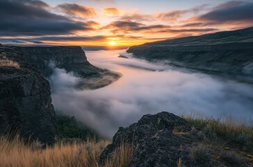 Fototapeta premium Fog rolling over riverbanks in early sunrise