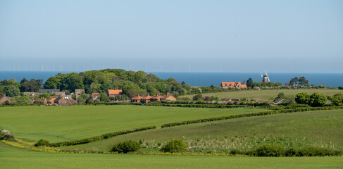 Long distance photo of the seaside village of Weybourne on the North Norfolk Coast. Captured on a bright and sunny day