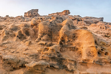 A rocky area with a hole in the ground