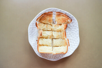 toast or bread with butter topping , toast bread or sliced bread
