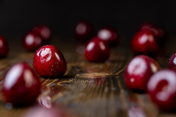 wet cherry fruits on the kitchen table closeup