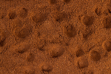 brown ground coffee bean background for making a high-quality and aromatic coffee drink, close up