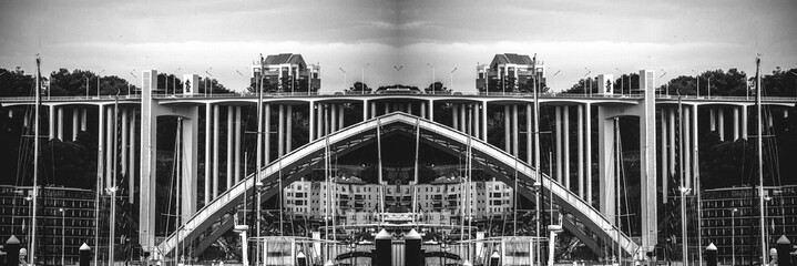 Artistic mirror of the bridge over river