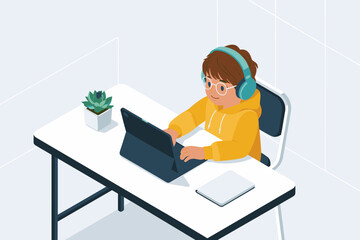 Child working on laptop at desk wearing headphones