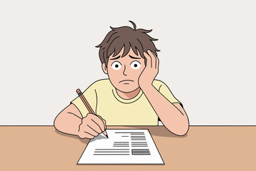 Young boy struggling with homework at table