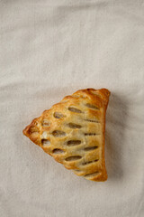 golden puff pastry on natural linen