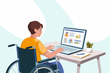 Person in wheelchair working on laptop at desk