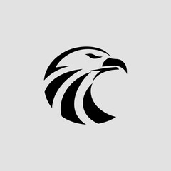 Obraz premium Modern, bold black eagle or hawk head logo in a circular, stylized design on a light gray background. For corporate identity, sports teams, or security branding.
