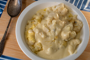 bowl of side dish baked cauliflower cheese 