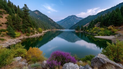Tranquil Dusk Over Calm Lake Surrounded by Dense Pine Forest and Scenic Mountains