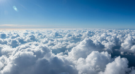 Fototapeta premium Sky High: Stunning Cloudscape Under a Brilliant Blue Sky - Aerial View Beauty!