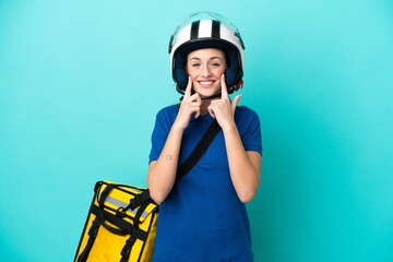 Young caucasian woman with thermal backpack isolated on white background smiling with a happy and pleasant expression