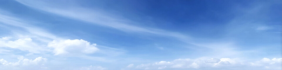 Obraz premium clear summer sky filled with soft, fluffy cumulus clouds creates serene and peaceful atmosphere, inviting relaxation and contemplation