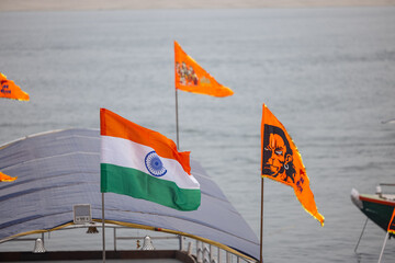 Religious flag of hindu god ram and hanuman near river ganga in varanasi.