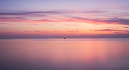 Fototapeta premium Serene Sunset Sail: A Pastel Symphony of Sky and Sea with Lonely Boat Silhouette for Peace & Travel Vibes.
