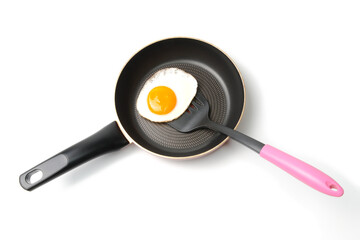 フライパンで焼いた卵焼きとフライ返し