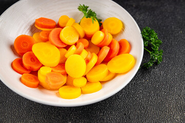 Carrot rings boiled vegetable vegetable dish fresh delicious gourmet food background on the table rustic food top view copy space keto and paleo diet vegetarian and vegan food