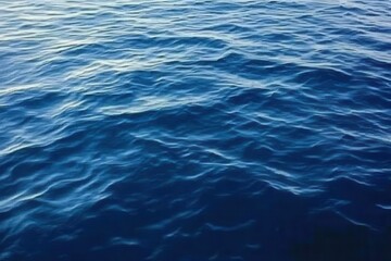 Rippled Blue Ocean Surface With Subtle Waves Under Natural Light Showing Water Texture and Deepness and Cleanliness of Marine Environment