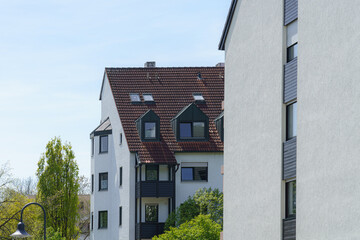 Modern residential buildings with natural greenery on a sunny day in an urban area