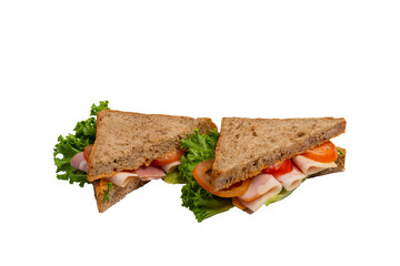 Two ham sandwiches with lettuce, tomato, and ham on whole-wheat bread are isolated on a white background.