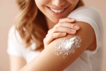Fototapeta premium A woman applies coconut oil to her elbows enhancing moisture and skin health in her daily skincare routine.