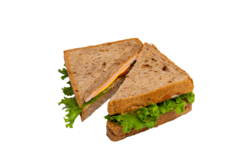 Two ham sandwiches with lettuce, tomato, and ham on whole-wheat bread are isolated on a white background.