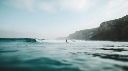 Surfer riding a wave near rocky coastline at dawn Generative AI