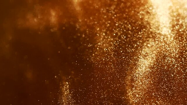 Gold particles floating background, Liquid gold, golden abstract backdrop. Golden abstract backdrop. Beautiful metallic yellow texture, swirls. Metallic paint close-up. Art Wallpaper waves surface. 