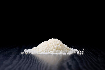 Raw Japanese rice served on a black background