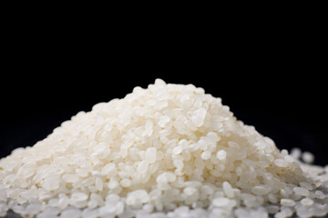 Raw Japanese rice served on a black background