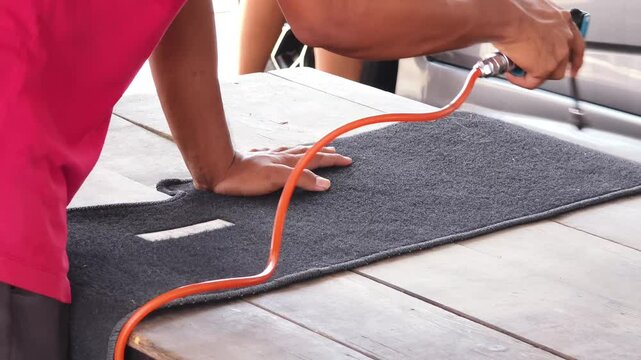 The professional car carpet cleaning process in action ensuring a spotless and fresh appearance