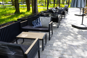outdoor tables in the cafe. Comfortable summer veranda of the restaurant