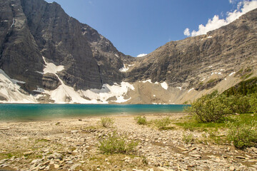 Glacier Mountain with teal green lake on summer day