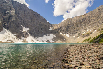 Glacier Mountain with teal green lake on summer day