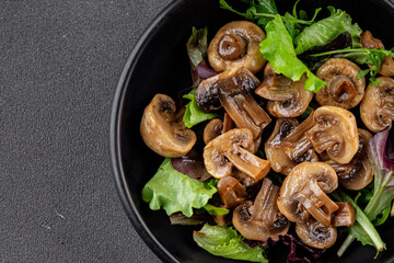Mushrooms pickled champignon salad snack fresh delicious gourmet food background on the table rustic food top view copy space keto and paleo diet vegetarian and vegan food