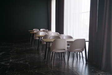 Empty chairs and table in a cafe, interior design concept, vintage tone
