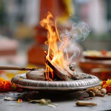 Homa or havan fire ceremony performed at home. Incense and ghee are thrown into fire. Homa havan